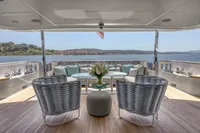 Luxurious 2022 Custom Line 37 yacht deck with elegant seating and scenic ocean view.