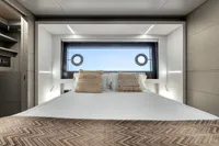 Luxurious yacht bedroom with modern design, large window, and cozy bedding, Custom Line 37, 2022.