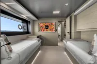 Luxurious 2022 Custom Line 37 yacht cabin with twin beds and modern decor.