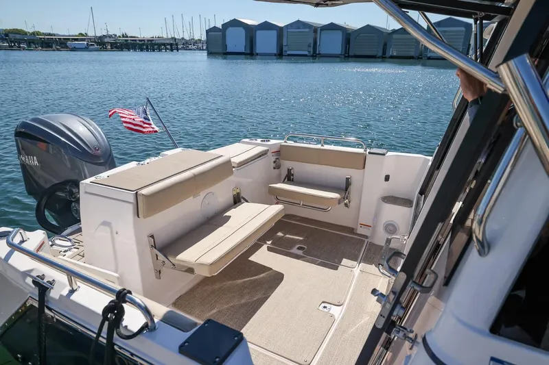  Yacht Photos Pics 2026 Cutwater C-248 Coupe boat interior with seating, docked by marina.