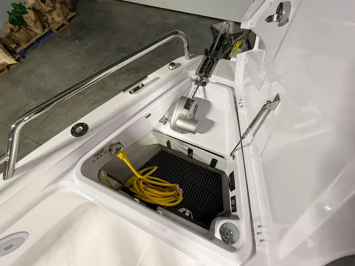  Yacht Photos Pics 2021 Axopar 37 XC CROSS CABIN anchor compartment with yellow rope and winch.