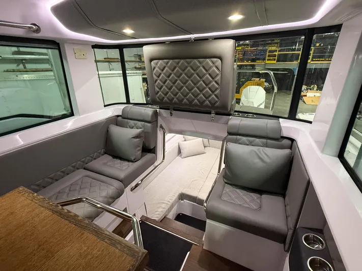  Yacht Photos Pics Luxurious interior of 2021 Axopar 37 XC CROSS CABIN with plush seating and modern design.