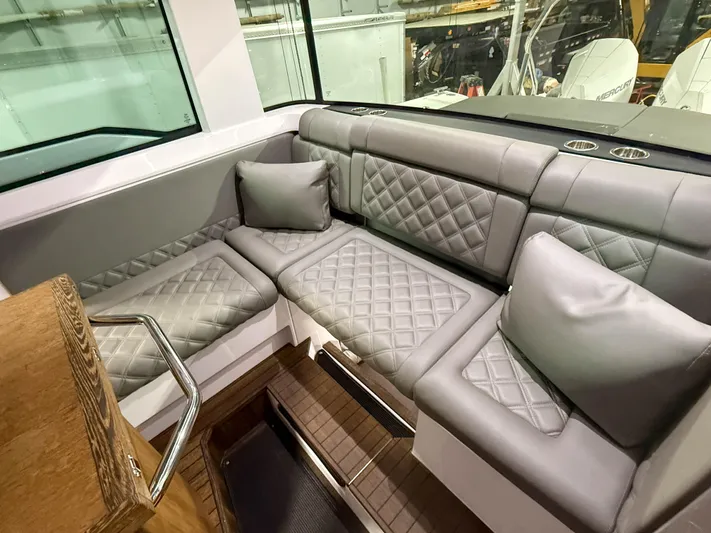  Yacht Photos Pics Luxurious seating in 2021 Axopar 37 XC CROSS CABIN with quilted upholstery and cushions.