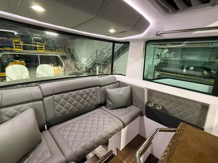  Yacht Photos Pics Interior of 2021 Axopar 37 XC CROSS CABIN with luxurious seating and modern design.