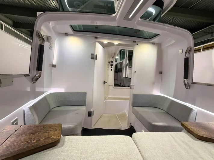  Yacht Photos Pics Interior of 2021 Axopar 37 XC CROSS CABIN, featuring modern seating and sleek design.