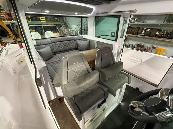  Yacht Photos Pics Interior of 2021 Axopar 37 XC CROSS CABIN with luxurious seating and modern design.