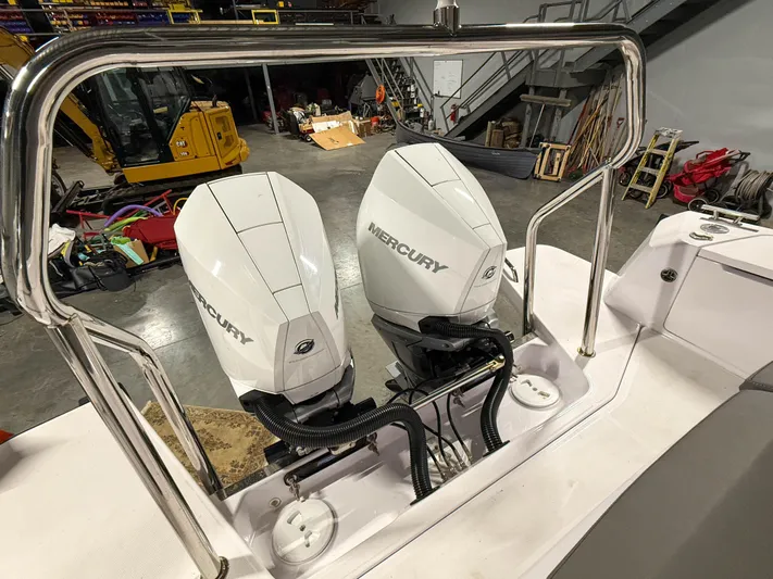  Yacht Photos Pics Twin Mercury outboard engines on a 2021 Axopar 37 XC CROSS CABIN boat in a workshop.