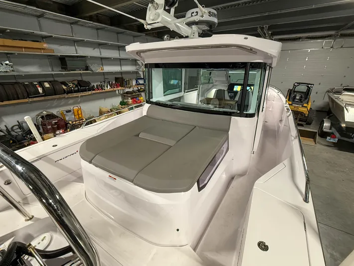  Yacht Photos Pics 2021 Axopar 37 XC CROSS CABIN boat in a garage setting.