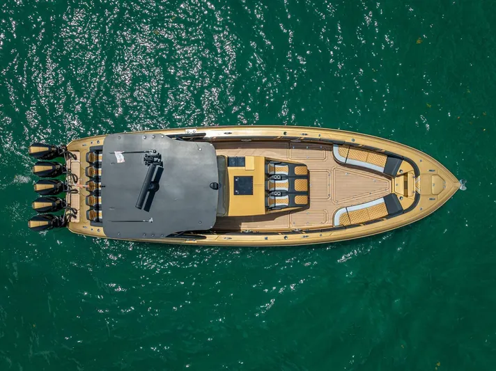 Perla Bianca II Yacht Photos Pics Aerial view of 2023 Midnight Express 43 Open boat on turquoise water.