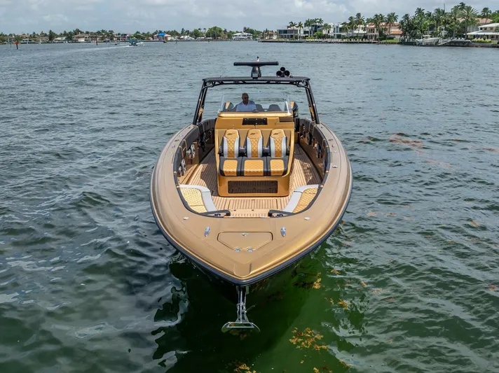 Perla Bianca II Yacht Photos Pics 2023 Midnight Express 43 Open boat on calm water, showcasing luxury design and spacious seating.