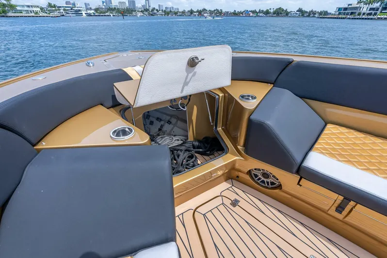 Perla Bianca II Yacht Photos Pics 2023 Midnight Express 43 Open boat interior with luxurious seating and storage.