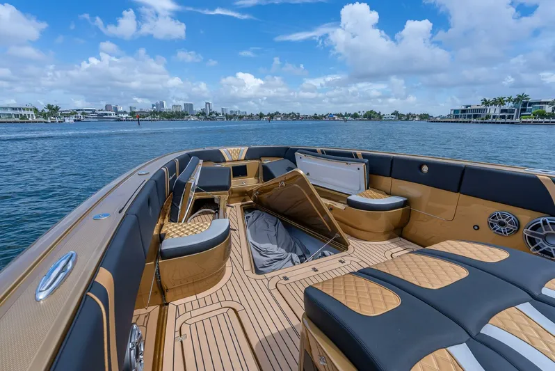 Perla Bianca II Yacht Photos Pics Luxurious 2023 Midnight Express 43 Open boat interior with elegant seating and scenic waterfront view.