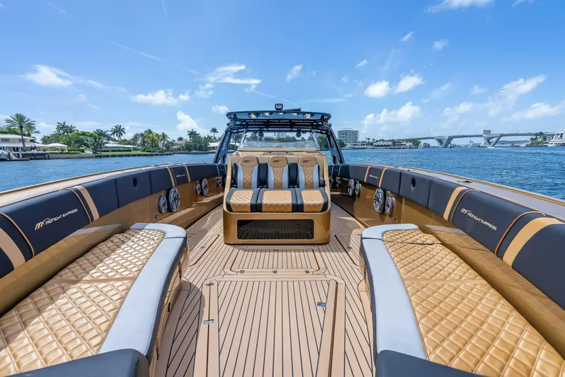 Perla Bianca II Yacht Photos Pics 2023 Midnight Express 43 Open luxury boat interior with tan seating and scenic water view.