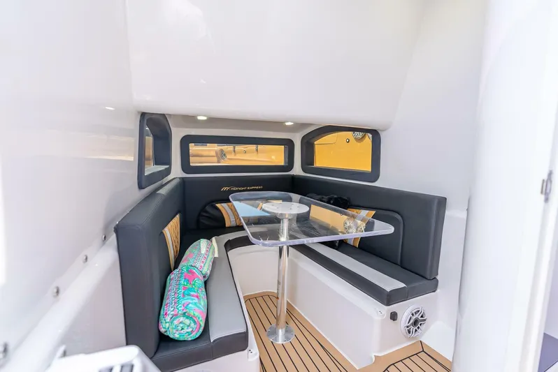Perla Bianca II Yacht Photos Pics 2023 Midnight Express 43 Open cabin interior with sleek seating and modern design.