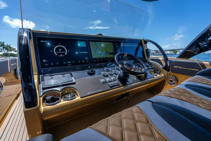 Perla Bianca II Yacht Photos Pics 2023 Midnight Express 43 Open yacht dashboard with advanced navigation and control systems.