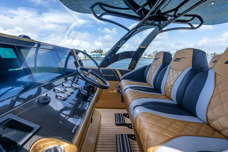 Perla Bianca II Yacht Photos Pics Interior of 2023 Midnight Express 43 Open boat with luxury seating and modern dashboard.