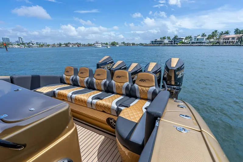 Perla Bianca II Yacht Photos Pics 2023 Midnight Express 43 Open luxury boat with stylish seating and powerful engines on a sunny day.