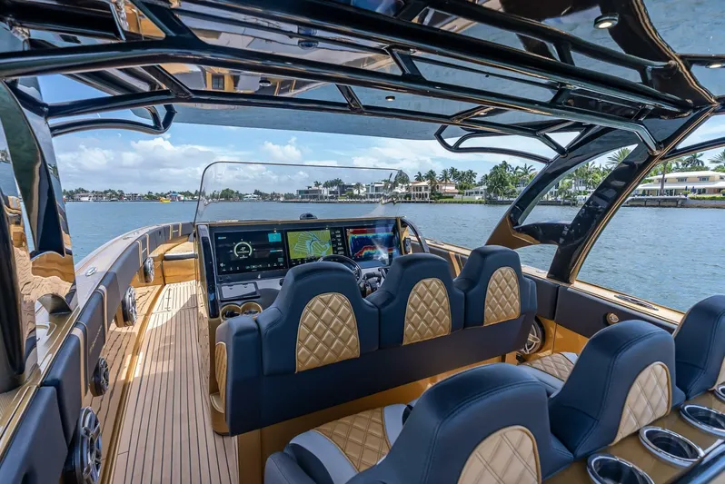 Perla Bianca II Yacht Photos Pics Luxurious 2023 Midnight Express 43 Open yacht interior with advanced navigation system and plush seating.