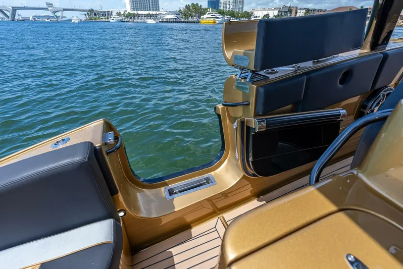 Perla Bianca II Yacht Photos Pics 2023 Midnight Express 43 Open boat interior with luxurious seating and water view.