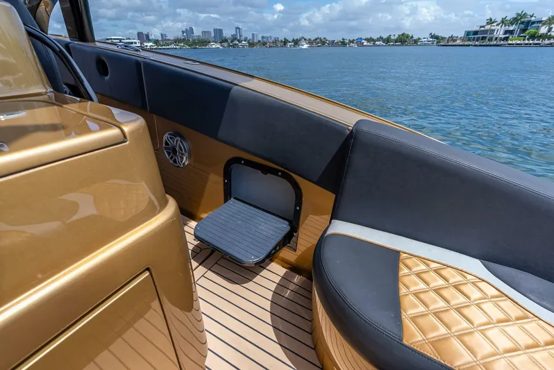 Perla Bianca II Yacht Photos Pics 2023 Midnight Express 43 Open luxury boat interior with quilted seating and water view.