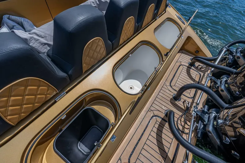 Perla Bianca II Yacht Photos Pics 2023 Midnight Express 43 Open boat interior with storage compartments and seating.