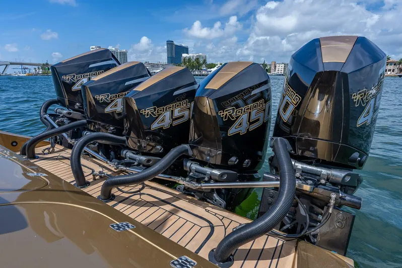 Perla Bianca II Yacht Photos Pics Four powerful outboard engines on a 2023 Midnight Express 43 Open boat, docked in a marina.