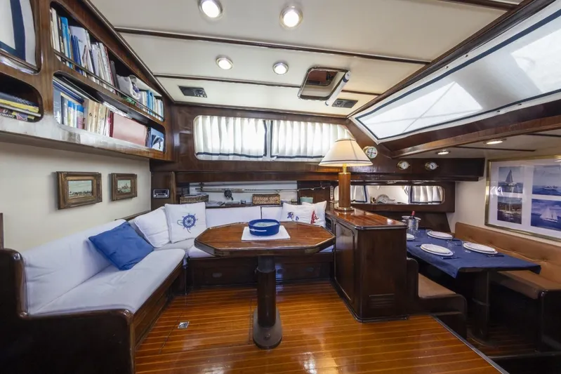  Yacht Photos Pics Luxurious interior of 1982 Benetti Sail Division 16m Motorsailer with elegant wood finishes.