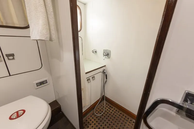  Yacht Photos Pics Bathroom interior of 1982 Benetti Sail Division 16m Motorsailer, featuring shower and toilet.