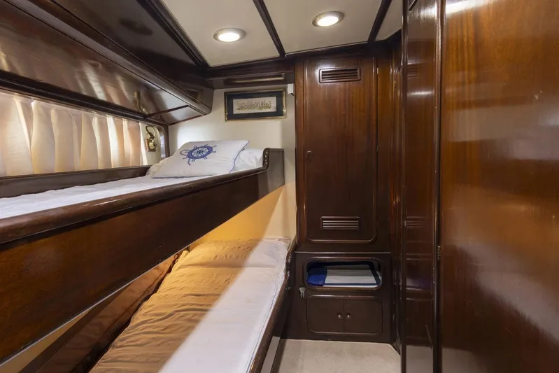  Yacht Photos Pics Cozy cabin interior of 1982 Benetti Sail Division 16m Motorsailer with wooden bunk beds.