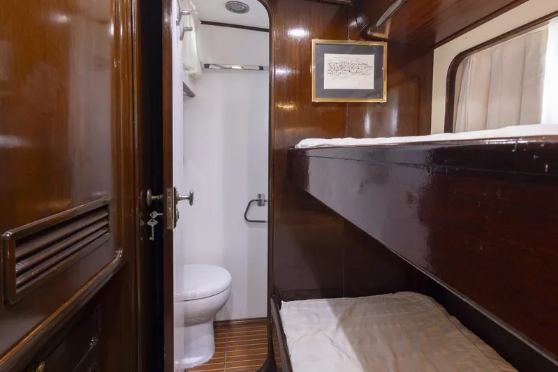  Yacht Photos Pics Interior of 1982 Benetti Sail Division 16m Motorsailer with wooden bunk beds and bathroom.
