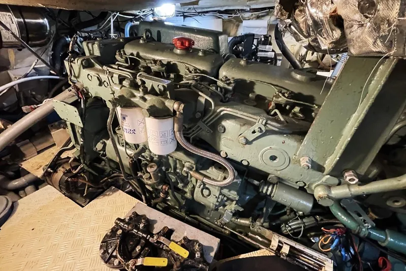  Yacht Photos Pics Engine room of a 1982 Benetti Sail Division 16m Motorsailer, showcasing detailed machinery.