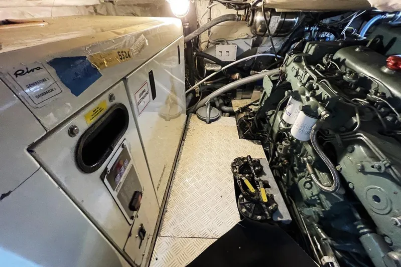  Yacht Photos Pics Engine room of a 1982 Benetti Sail Division 16m Motorsailer, featuring generator and machinery.