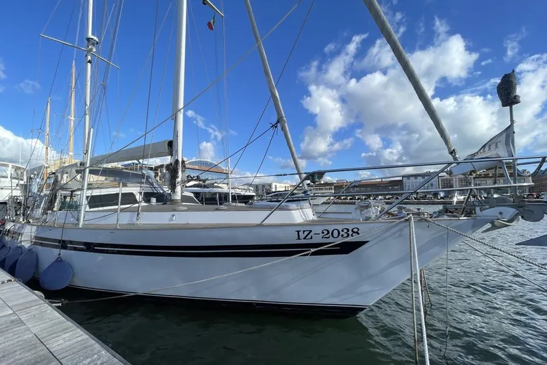  Yacht Photos Pics 1982 Benetti Sail Division 16m Motorsailer docked at marina under blue sky.