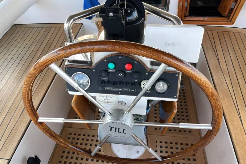  Yacht Photos Pics Steering wheel and controls of a 1982 Benetti Sail Division 16m Motorsailer.