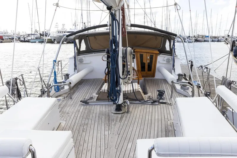  Yacht Photos Pics 1982 Benetti Sail Division 16m Motorsailer docked, showcasing spacious deck and elegant design.