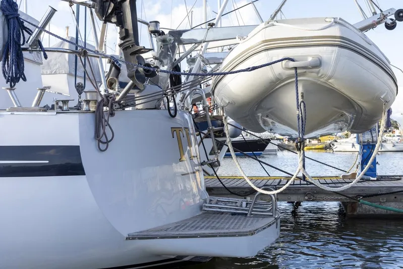  Yacht Photos Pics 1982 Benetti Sail Division 16m Motorsailer with dinghy at marina dock.