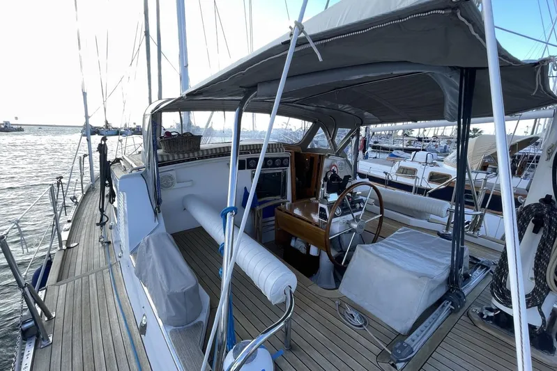  Yacht Photos Pics 1982 Benetti Sail Division 16m Motorsailer with wooden deck and covered cockpit in marina.