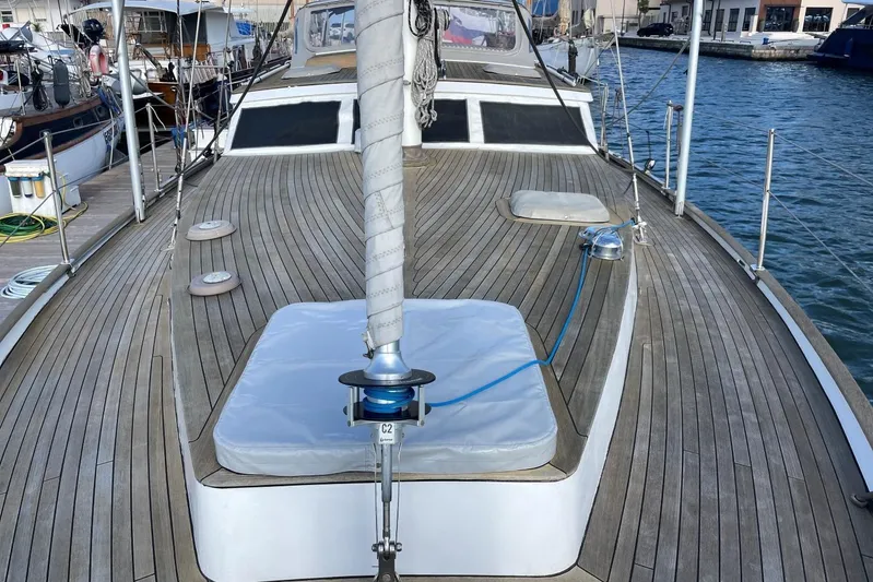  Yacht Photos Pics 1982 Benetti Sail Division 16m Motorsailer with wooden deck, docked at marina.