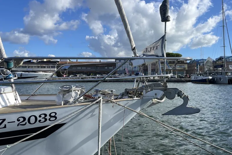  Yacht Photos Pics 1982 Benetti Sail Division 16m Motorsailer docked in a marina under a blue sky.
