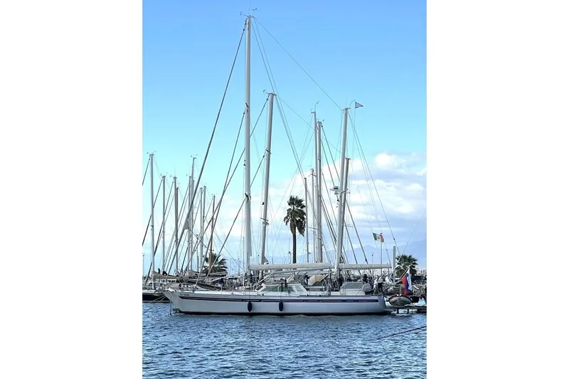  Yacht Photos Pics 1982 Benetti Sail Division 16m Motorsailer docked in a marina, clear sky background.
