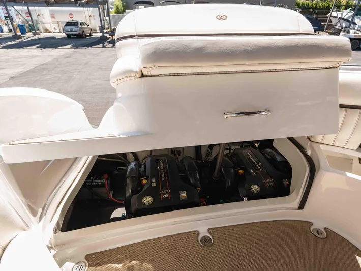  Yacht Photos Pics Open engine compartment of 2013 Cobalt 336 boat, showcasing dual engines and storage area.