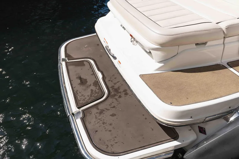  Yacht Photos Pics 2013 Cobalt 336 boat swim platform with cushioned seating and water view.