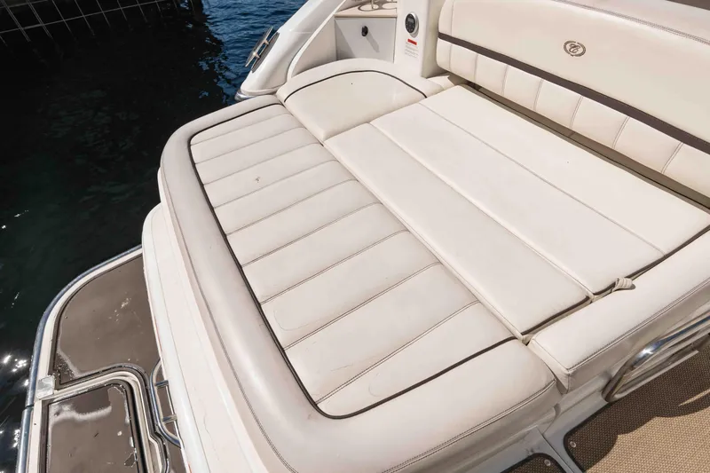  Yacht Photos Pics 2013 Cobalt 336 boat with white cushioned seating near water.
