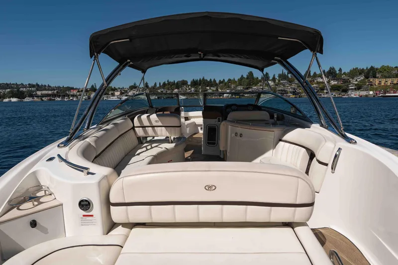  Yacht Photos Pics 2013 Cobalt 336 boat with spacious seating and canopy on a sunny day.