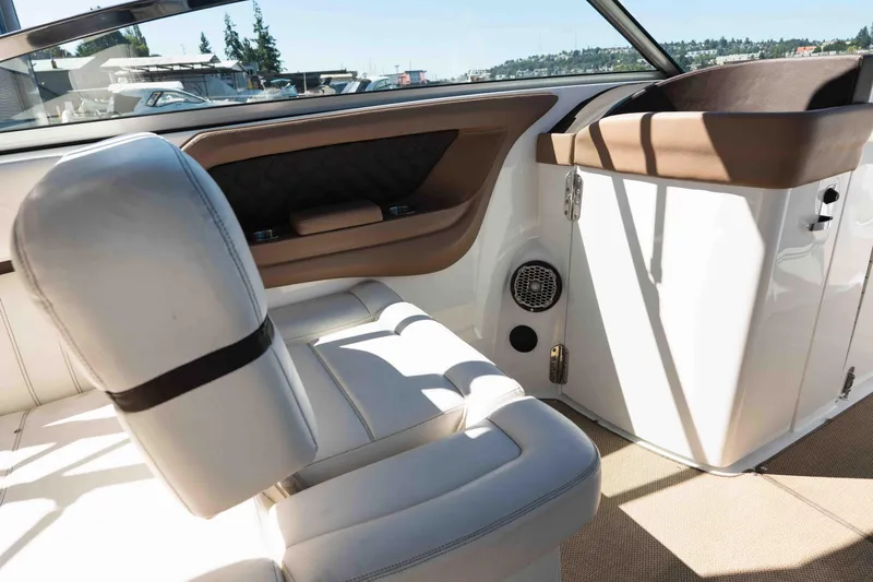  Yacht Photos Pics Interior of a 2013 Cobalt 336 boat with white and brown seating.