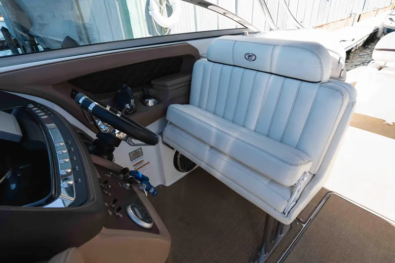  Yacht Photos Pics 2013 Cobalt 336 boat interior with white leather seating and modern dashboard controls.