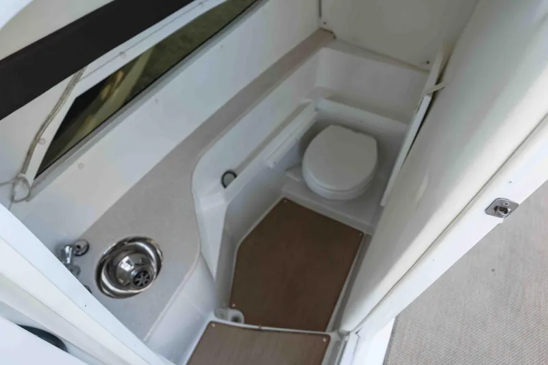  Yacht Photos Pics 2013 Cobalt 336 boat interior bathroom with sink and toilet.