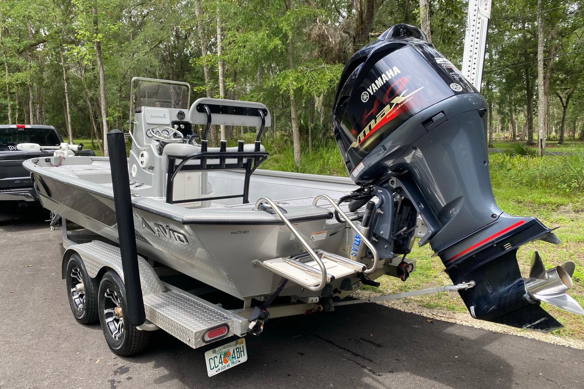 2021 Avid 23 FS Magnum boat with Yamaha outboard motor on trailer.