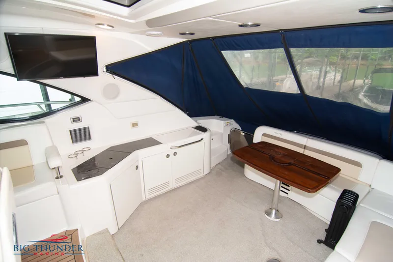  Yacht Photos Pics 2013 Sea Ray 540 Sundancer interior with seating, table, and TV.