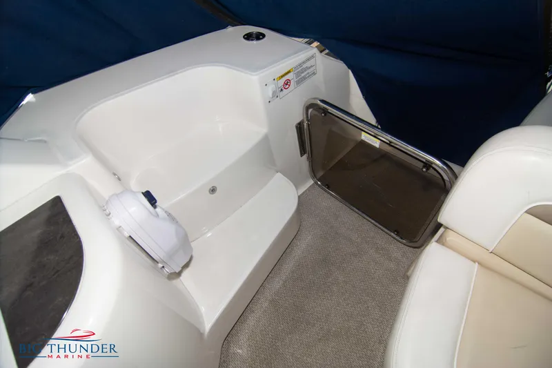  Yacht Photos Pics Interior seating area of 2013 Sea Ray 540 Sundancer yacht with white upholstery.